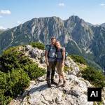 Couple posing on mountain peak